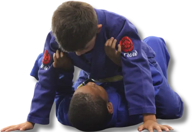 Kids practicing Brazilian Jiu-Jitsu ground technique