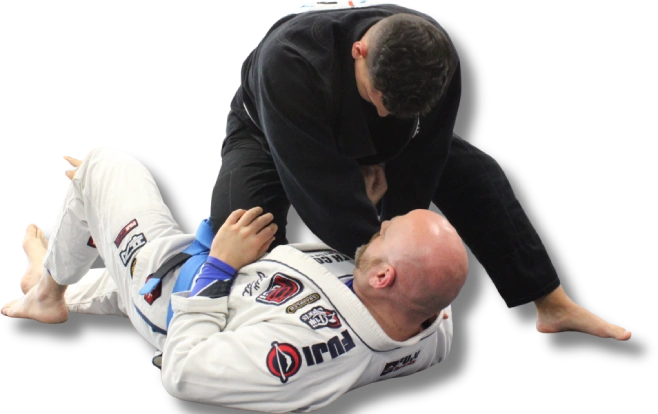 Jiu-Jitsu instructor demonstrating top control from guard